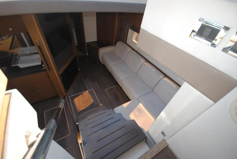 Slide: The Image of Luxurious interior of 2017 Sea Ray Sundancer 510 yacht with modern seating and wood flooring. - 20