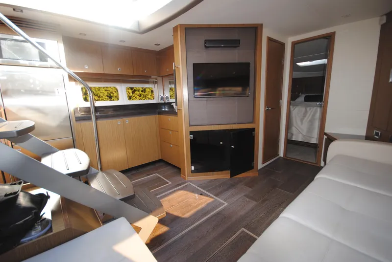 Slide: The Image of Luxurious interior of 2017 Sea Ray Sundancer 510 yacht with modern kitchen and seating area. - 21
