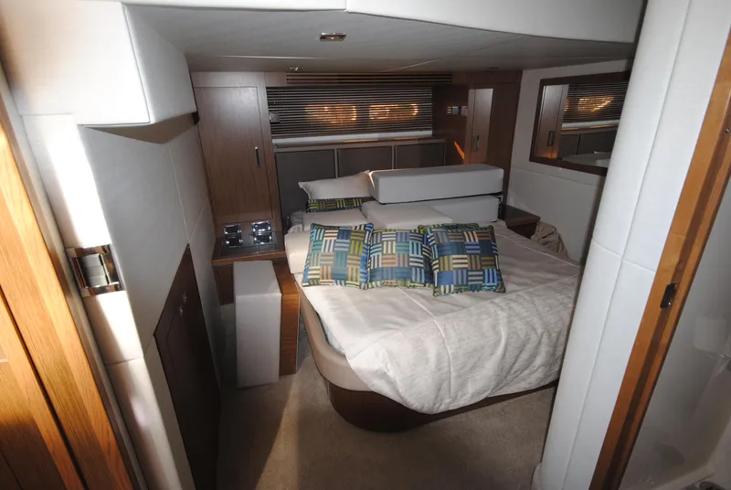 Slide: The Image of Luxurious 2017 Sea Ray Sundancer 510 cabin with modern bedding and stylish decor. - 28