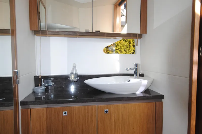 Slide: The Image of Luxurious bathroom interior of 2017 Sea Ray Sundancer 510 yacht with modern sink and cabinetry. - 29