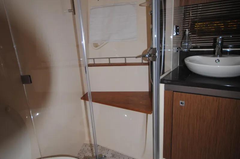 Slide: The Image of 2017 Sea Ray Sundancer 510 bathroom with modern sink and shower. - 30