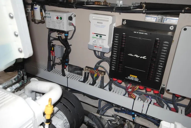 Slide: The Image of Engine room of 2017 Sea Ray Sundancer 510 with electrical panels and wiring. - 34