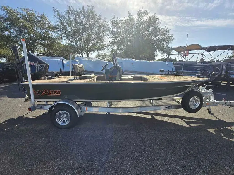 Slide: The Image of 2025 Mako 18 Pro Skiff Backwater Edition on trailer, parked outdoors. - 1