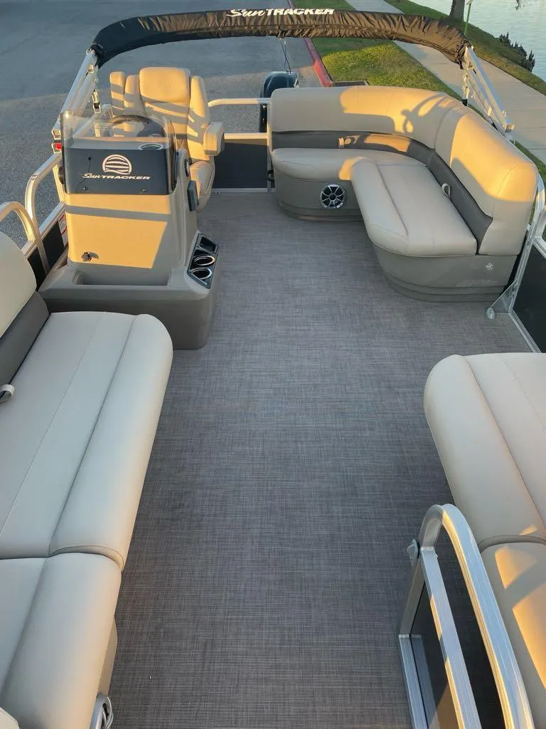 Slide: The Image of 2025 Sun Tracker Party Barge 16 DLX interior with spacious seating and modern design. - 3