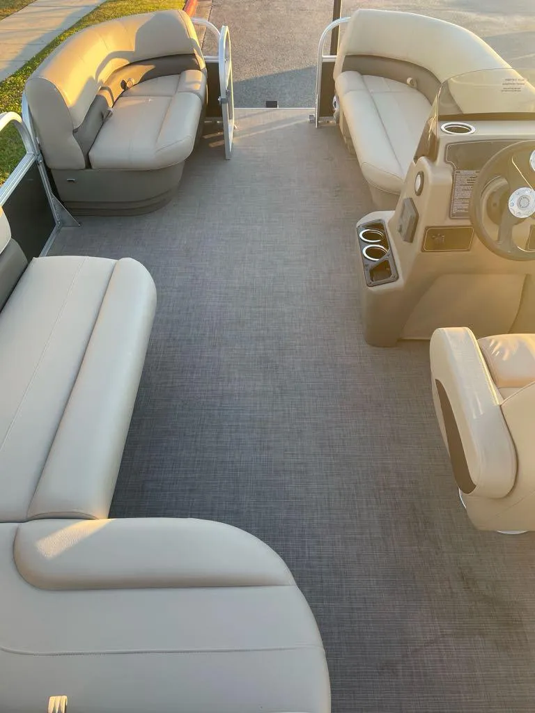 Slide: The Image of 2025 Sun Tracker Party Barge 16 DLX interior with spacious seating and modern design. - 4