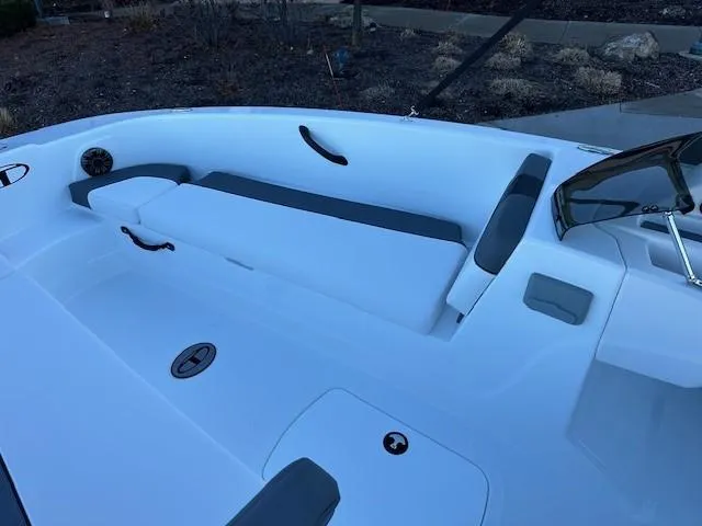 Slide: The Image of 2025 Tahoe T18 boat interior with white seating and sleek design. - 5