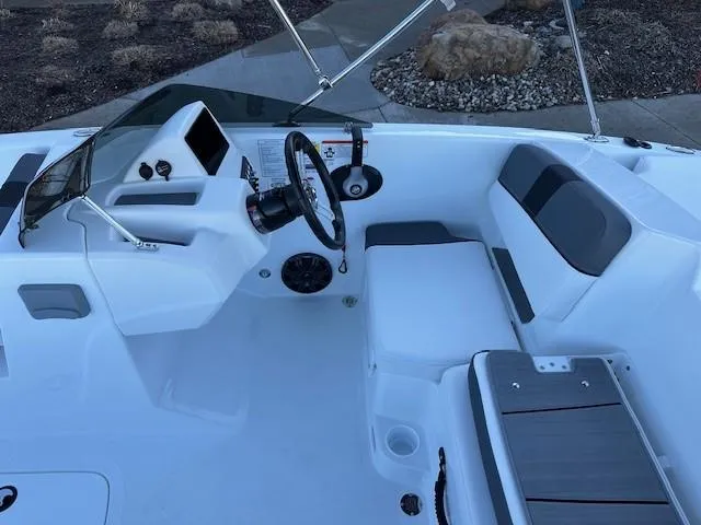 Slide: The Image of 2025 Tahoe T18 boat interior with steering wheel and seating area. - 6