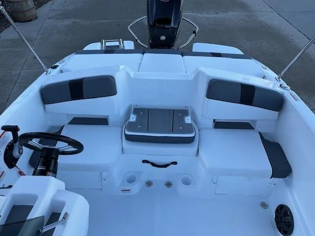 Slide: The Image of 2025 Tahoe T18 boat interior with seating and steering wheel. - 9