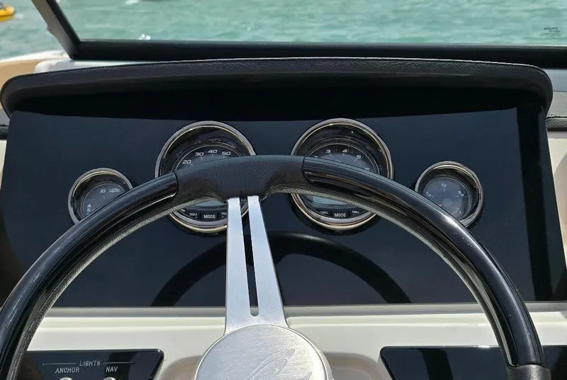Slide: The Image of Steering wheel and dashboard of 2023 Sea Ray SPX 210 boat. - 3