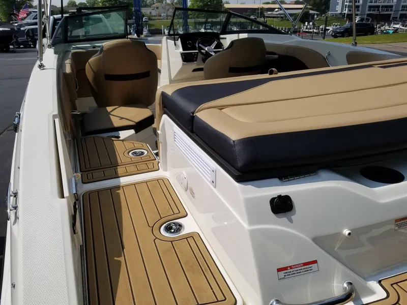 Slide: The Image of 2023 Sea Ray SPX 210 boat interior with tan seating and deck. - 5