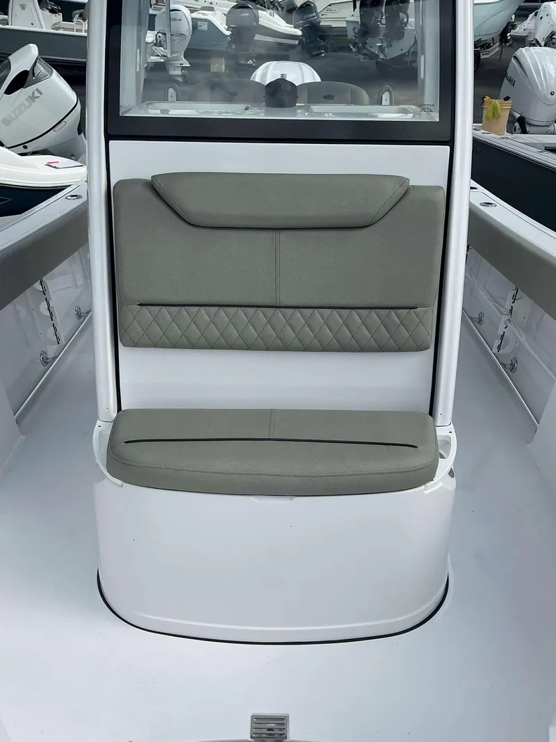 Slide: The Image of 2025 Sportsman 231 Heritage boat interior with cushioned seating and modern design. - 10