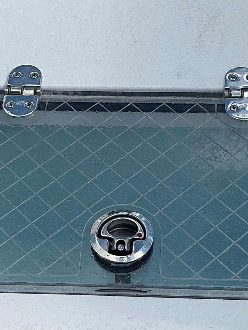 Slide: The Image of Hinged compartment on 2025 Sportsman 231 Heritage boat with metal latch. - 14