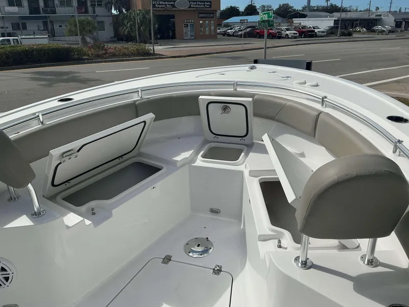 Slide: The Image of 2025 Sportsman 231 Heritage boat interior with open storage compartments and seating. - 8