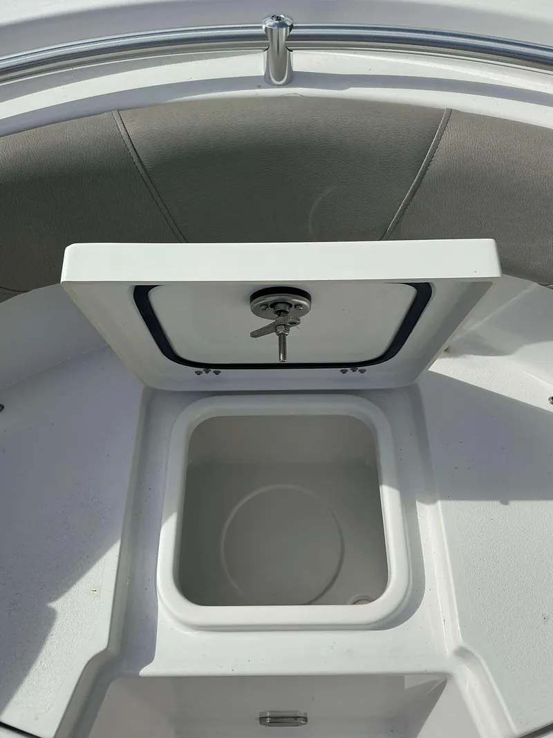 Slide: The Image of 2025 Sportsman 231 Heritage boat storage compartment with open hatch. - 9