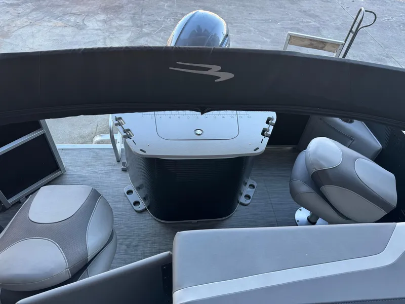 Slide: The Image of 2020 Bennington SX21 boat interior with seating and motor view. - 6
