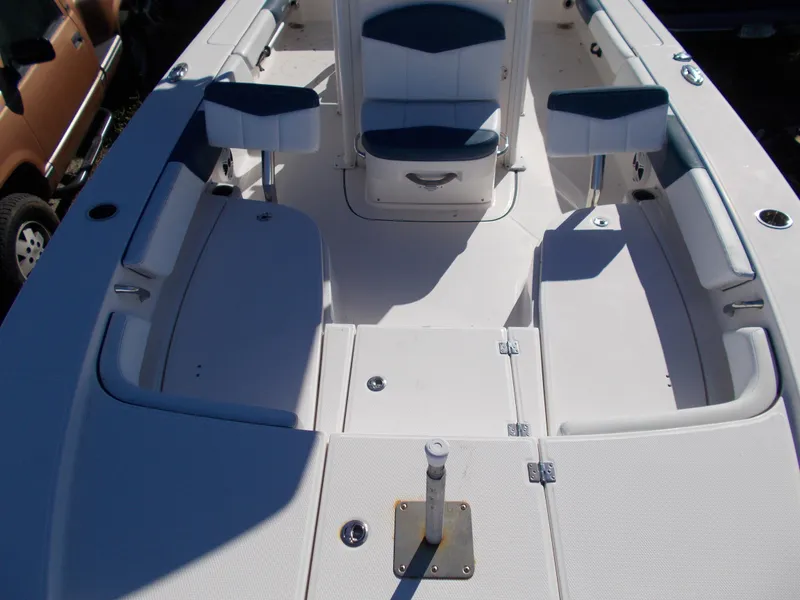 Slide: The Image of 2020 Robalo 246 Cayman boat interior with seating and storage compartments. - 12