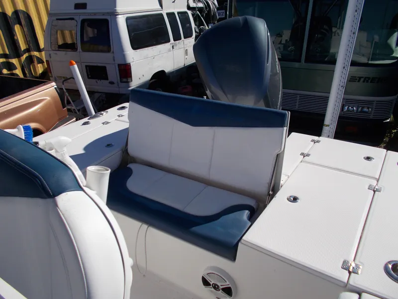 Slide: The Image of 2020 Robalo 246 Cayman boat interior with blue and white seating. - 13