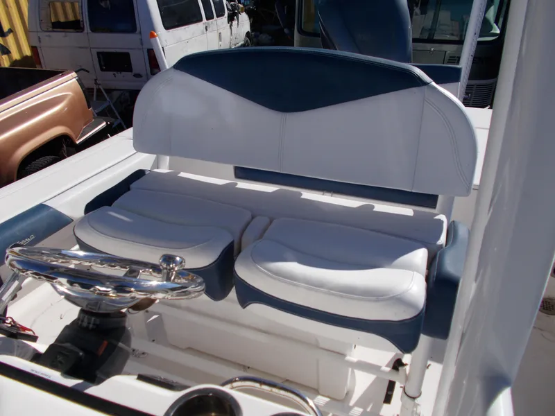 Slide: The Image of 2020 Robalo 246 Cayman boat interior with white and blue seating. - 14