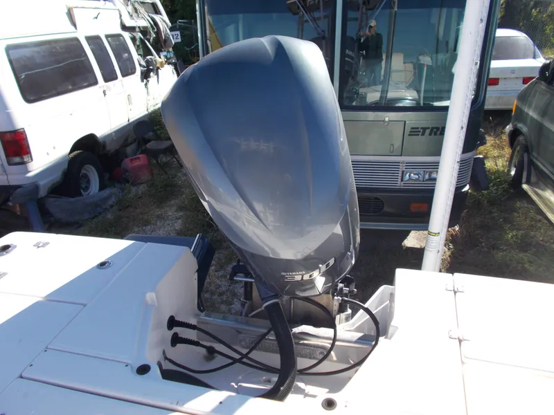Slide: The Image of 2020 Robalo 246 Cayman boat with Yamaha outboard motor in a storage area. - 6