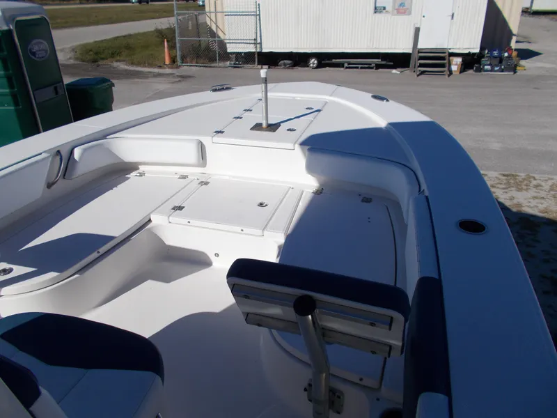 Slide: The Image of 2020 Robalo 246 Cayman boat interior with seating and storage compartments. - 9
