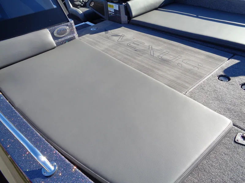 Slide: The Image of 2025 Vexus DVX22S boat interior with cushioned seating and sleek design. - 11