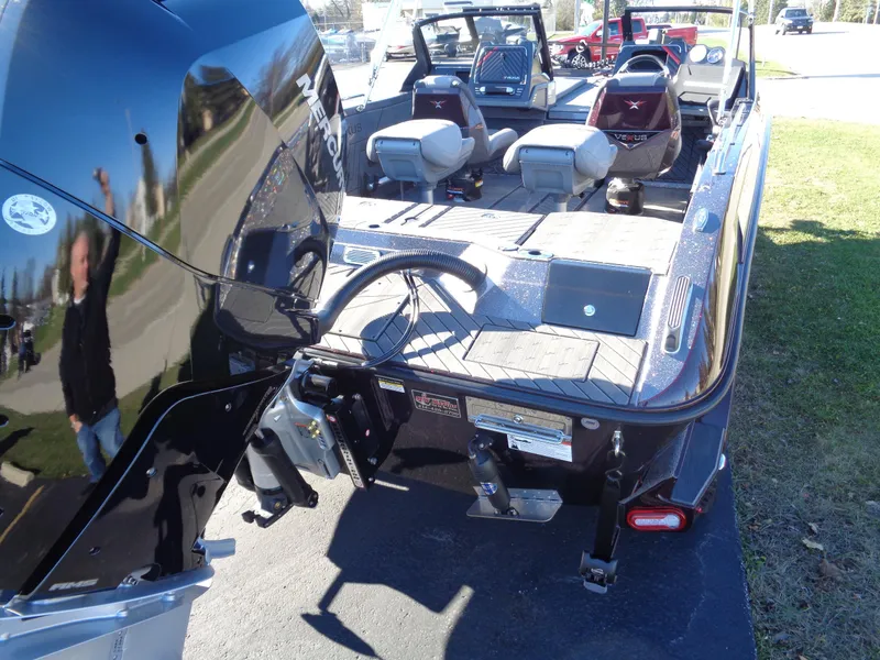 Slide: The Image of 2025 Vexus DVX22S boat with outboard motor and spacious seating area. - 14