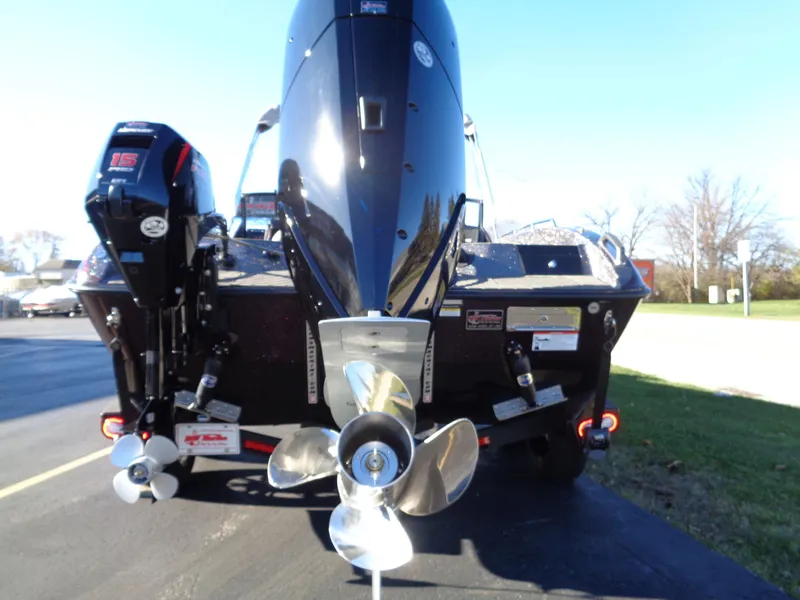 Slide: The Image of 2025 Vexus DVX22S boat rear view with dual propellers and outboard motor. - 18