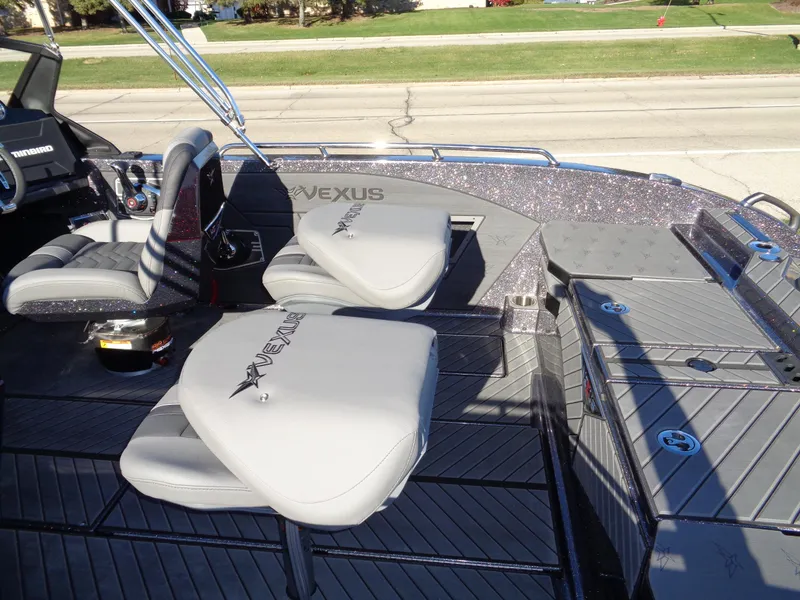 Slide: The Image of 2025 Vexus DVX22S boat interior with gray seating and sleek design. - 23