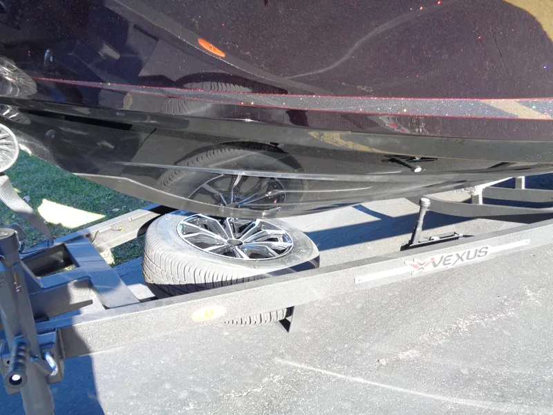 Slide: The Image of 2025 Vexus DVX22S boat on trailer with spare tire. - 29