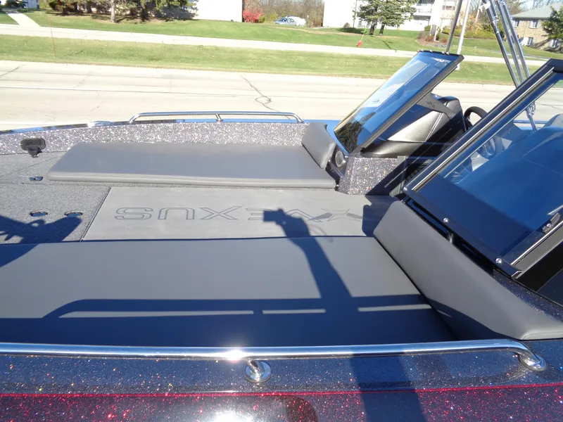 Slide: The Image of 2025 Vexus DVX22S boat deck with sleek design and windshield. - 30