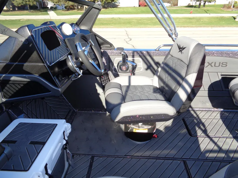 Slide: The Image of Interior of 2025 Vexus DVX22S boat with steering wheel and seating. - 31