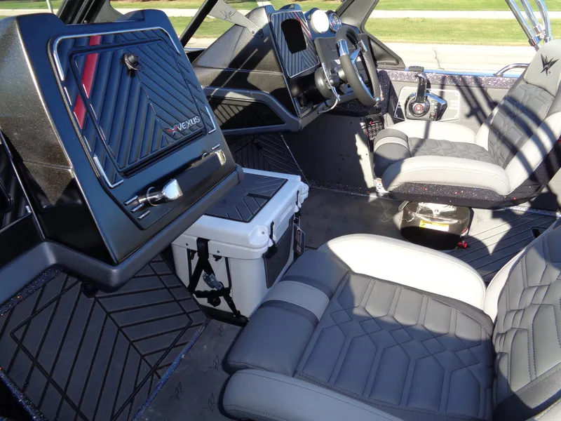 Slide: The Image of Interior of 2025 Vexus DVX22S boat with modern seating and dashboard design. - 32