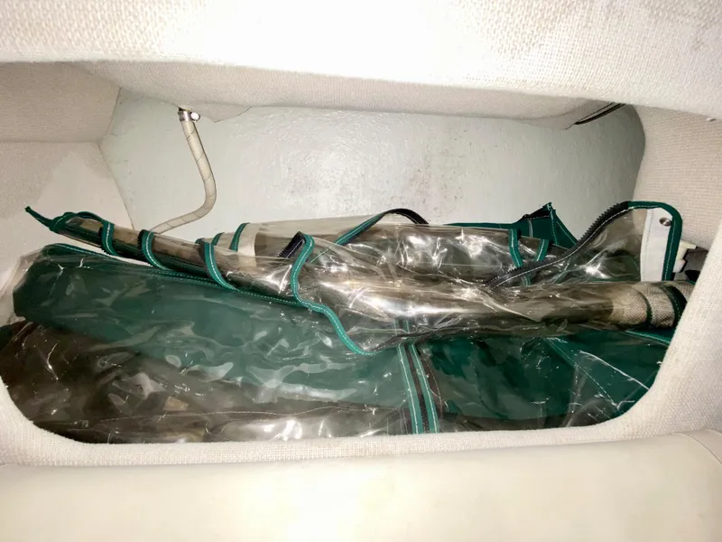 Slide: The Image of Stored canopy in 1999 Four Winns 258 Vista boat compartment. - 32