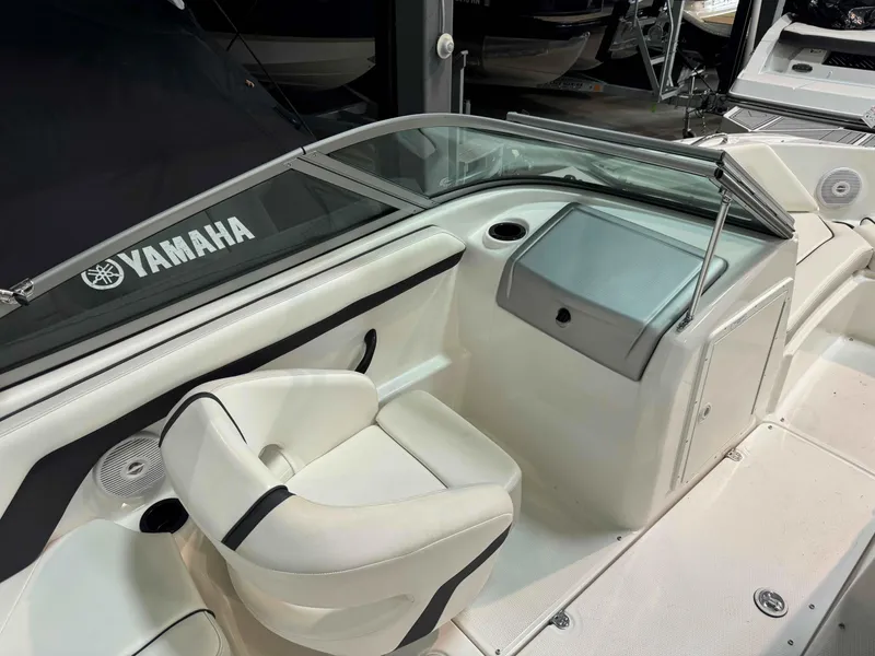Slide: The Image of 2015 Yamaha Boats SX190 interior with white seating and dashboard. - 6