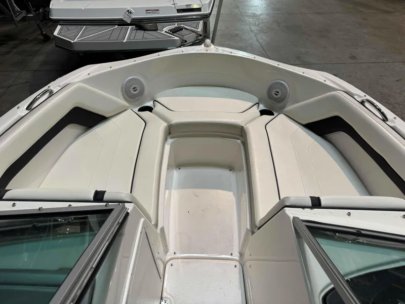 Slide: The Image of 2015 Yamaha Boats SX190 interior with white seating and speakers. - 7