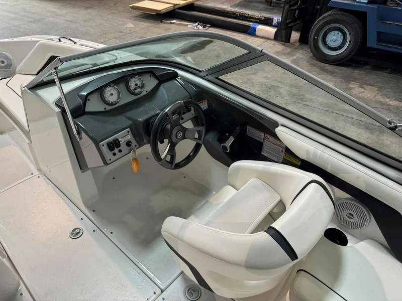 Slide: The Image of 2015 Yamaha Boats SX190 interior with steering wheel and dashboard controls. - 8