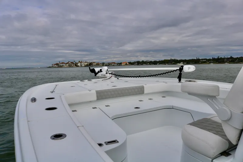 Slide: The Image of Freeman 28 boat on water, 2023 model, with coastal view under cloudy sky. - 15