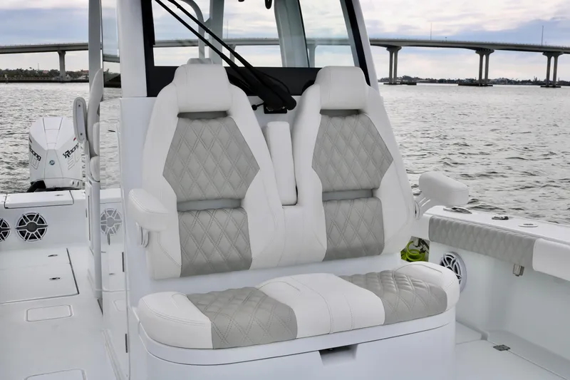 Slide: The Image of Luxurious seating on 2023 Freeman 28 boat with scenic bridge view. - 18