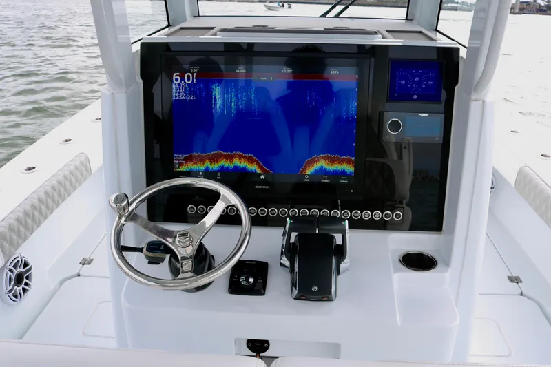 Slide: The Image of Freeman 28 boat dashboard with advanced navigation system, 2023 model. - 26