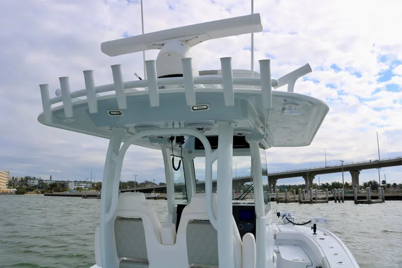 Slide: The Image of Freeman 28 boat, 2023 model, on water with bridge in background. - 28