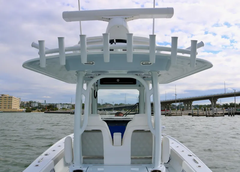 Slide: The Image of Freeman 28 boat, 2023 model, on water with bridge and buildings in background. - 29