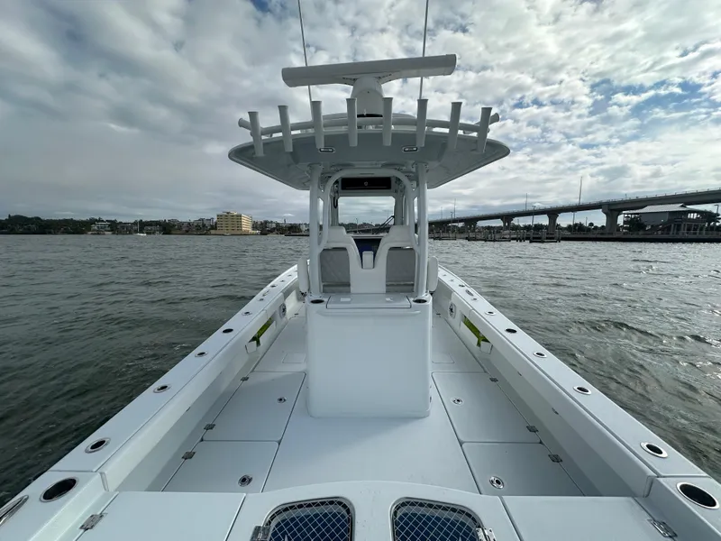 Slide: The Image of 2023 Freeman 28 boat on water, featuring spacious deck and modern design. - 37