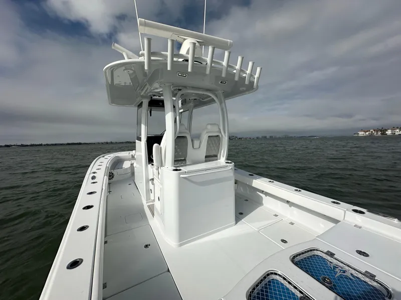 Slide: The Image of 2023 Freeman 28 boat on water, featuring sleek design and spacious deck. - 39