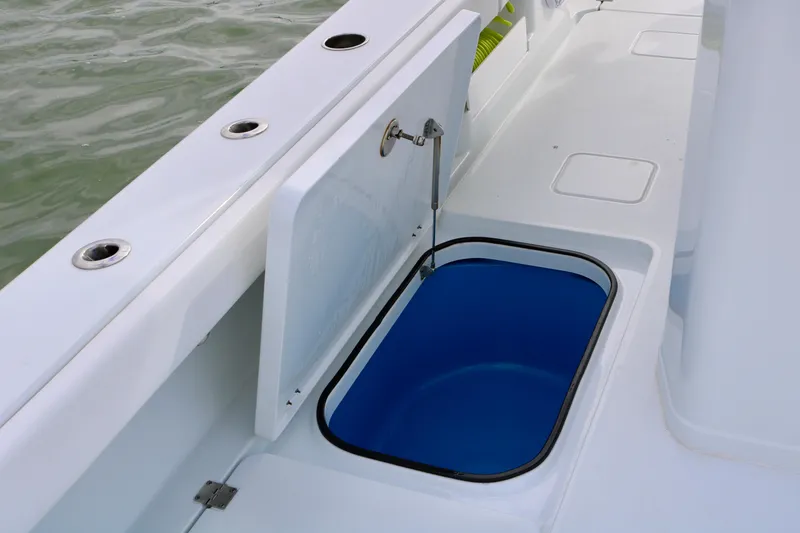 Slide: The Image of Freeman 28 boat livewell with open lid, 2023 model, blue interior. - 40