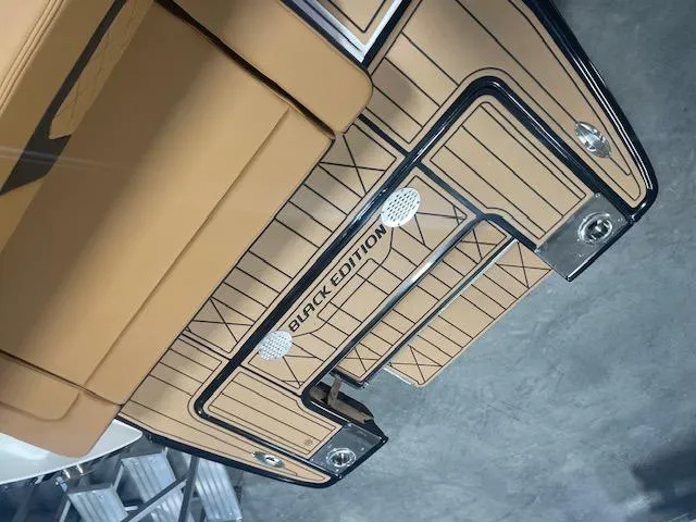 Slide: The Image of 2025 Chaparral 287 SSX Black Edition boat deck with sleek design and premium materials. - 12