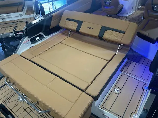 Slide: The Image of 2025 Chaparral 287 SSX boat interior with tan leather seating and modern design. - 7