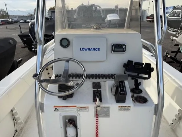 Slide: The Image of 2010 Carolina Skiff 25 Elite SS boat console with steering wheel and Lowrance electronics. - 10