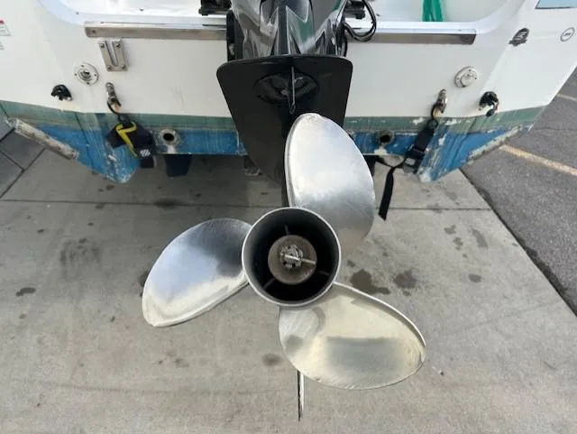 Slide: The Image of Propeller of 2010 Carolina Skiff 25 Elite SS boat on concrete surface. - 5