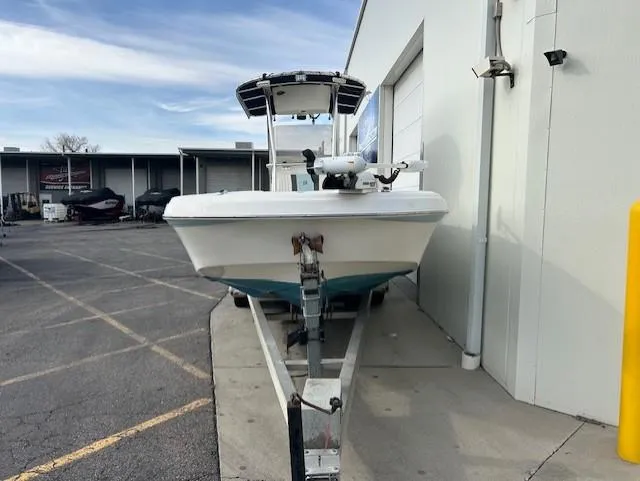 Slide: The Image of 2010 Carolina Skiff 25 Elite SS boat on trailer, parked outside a building. - 8