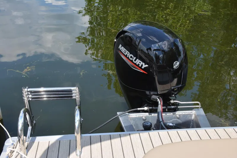 Slide: The Image of 2021 Sylvan Mirage 8522 LZ pontoon boat docked on a sunny canal. - 14